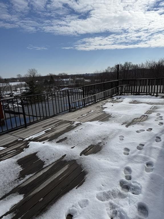 view of snow covered deck