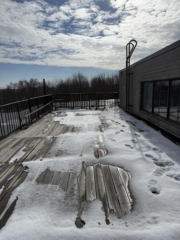 view of snow covered deck