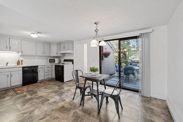 dining room with baseboards and visible vents
