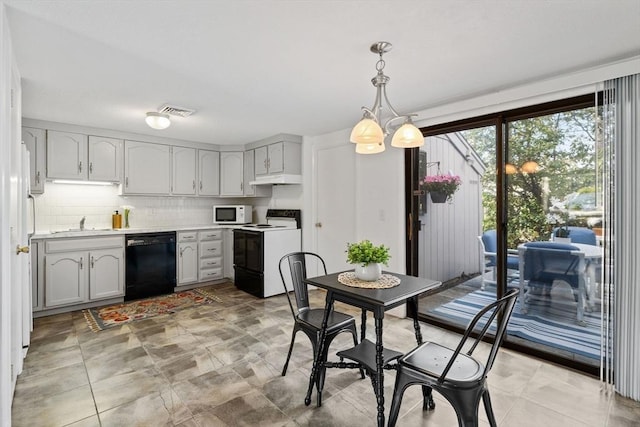 kitchen with visible vents, electric range oven, dishwasher, light countertops, and white microwave