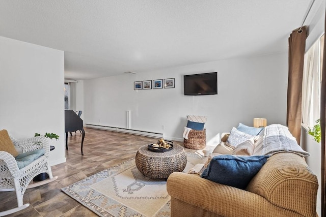 living room featuring baseboards and a baseboard heating unit