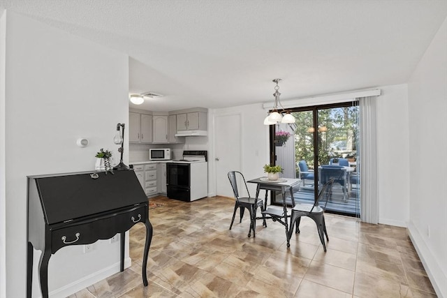 dining area featuring baseboards