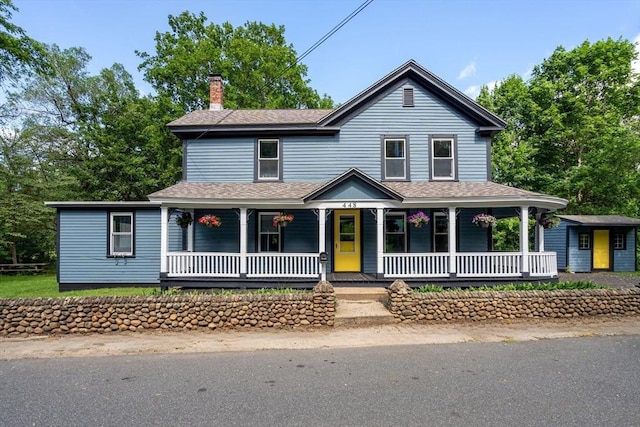 448 Washington St, Warren, MA 01083 - view of front of home featuring a chimney, covered porch, and a shingled roof