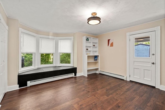 448 Washington St, Warren, MA 01083 - foyer entrance with baseboard heating, wood finished floors, and ornamental molding