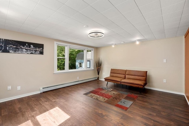 448 Washington St, Warren, MA 01083 - sitting room with a baseboard heating unit, wood finished floors, and track lighting