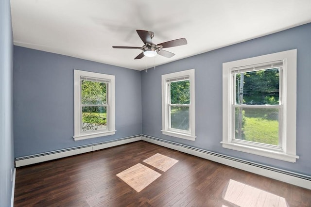 448 Washington St, Warren, MA 01083 - spare room with plenty of natural light, a baseboard heating unit, and wood finished floors