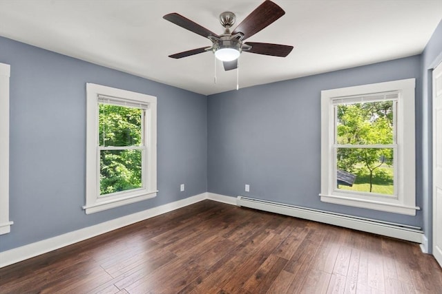 448 Washington St, Warren, MA 01083 - spare room with a baseboard radiator, dark wood-style flooring, and a ceiling fan