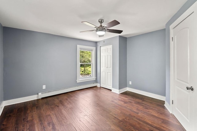 448 Washington St, Warren, MA 01083 - unfurnished bedroom with a baseboard heating unit, dark wood finished floors, and ceiling fan