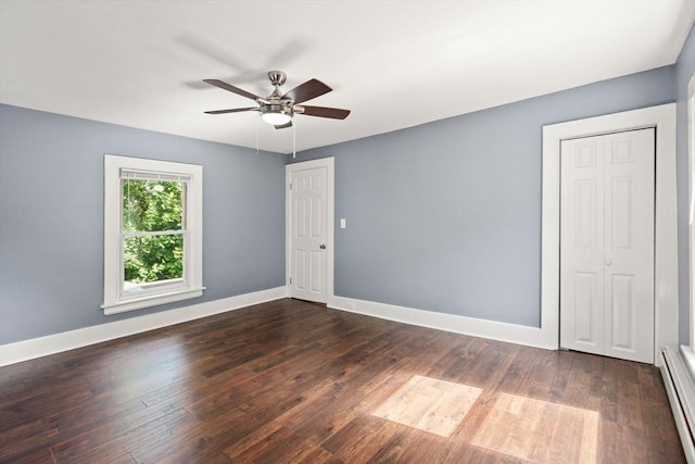 448 Washington St, Warren, MA 01083 - unfurnished room with a baseboard radiator, dark wood-style floors, and a ceiling fan