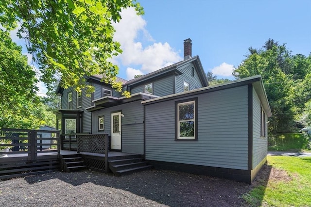 448 Washington St, Warren, MA 01083 - rear view of house with a deck and a chimney