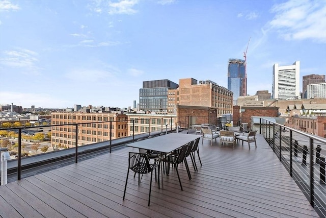 wooden deck with a city view