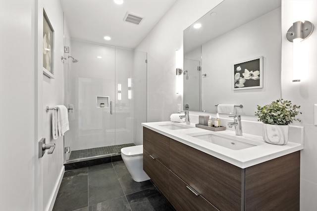 bathroom with toilet, vanity, and an enclosed shower