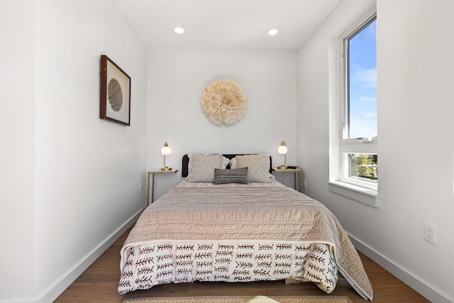 bedroom featuring dark hardwood / wood-style flooring