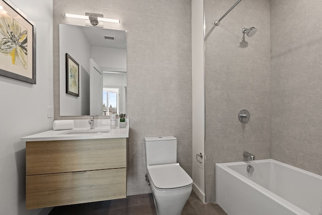 full bathroom featuring shower / bathing tub combination, toilet, vanity, and tile patterned flooring