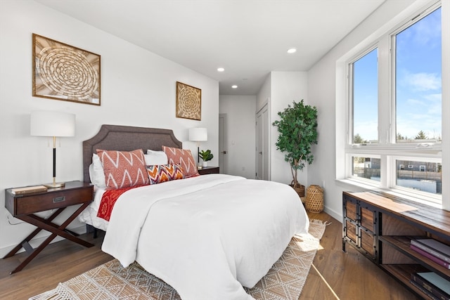 bedroom with dark wood-type flooring