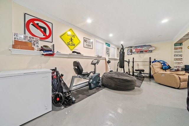 workout area featuring ornamental molding