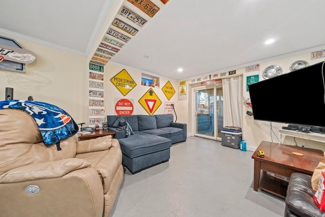 living room featuring ornamental molding and concrete floors