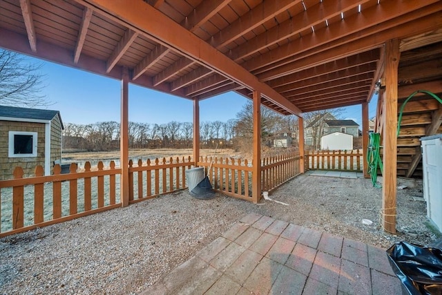 view of patio / terrace featuring a storage shed