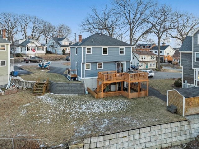 rear view of house featuring a deck