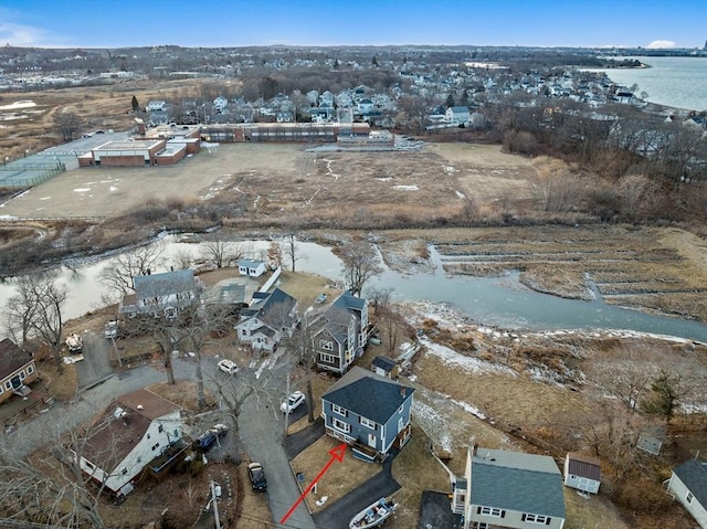 birds eye view of property with a water view