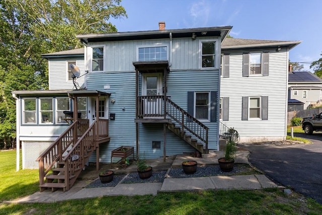 37 Thurston Ave Unit 37, Northbridge, MA 01588 - back of property featuring a chimney, a sunroom, and stairs