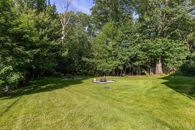 37 Thurston Ave Unit 37, Northbridge, MA 01588 - view of green lawn featuring an outdoor fire pit