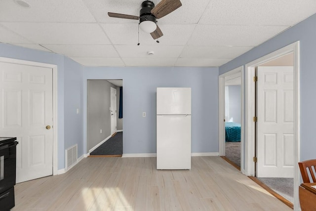 37 Thurston Ave Unit 37, Northbridge, MA 01588 - kitchen with freestanding refrigerator, a paneled ceiling, light wood-type flooring, baseboards, and ceiling fan