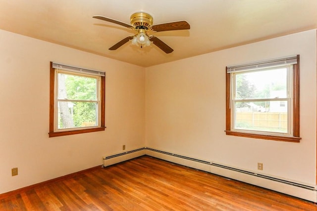 109 Bacon Rd, Springfield, MA 01119 - empty room featuring a baseboard heating unit, wood finished floors, and a ceiling fan
