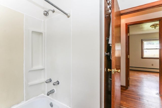 109 Bacon Rd, Springfield, MA 01119 - bathroom featuring a baseboard heating unit, bathing tub / shower combination, and wood finished floors