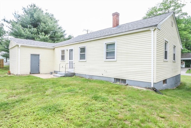 109 Bacon Rd, Springfield, MA 01119 - back of property with a chimney, a yard, and a shingled roof