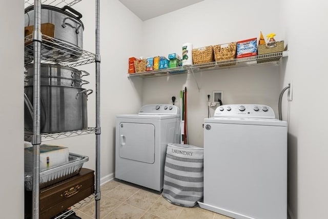 230 Martins Lndg Unit 310, North Reading, MA 01864 - washroom with washer and clothes dryer and tile patterned flooring