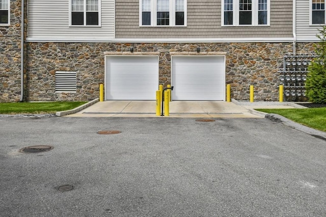 230 Martins Lndg Unit 310, North Reading, MA 01864 - garage featuring asphalt driveway
