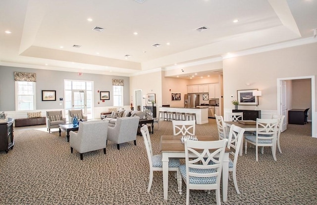 230 Martins Lndg Unit 310, North Reading, MA 01864 - dining room with a raised ceiling, light carpet, recessed lighting, a wainscoted wall, and crown molding