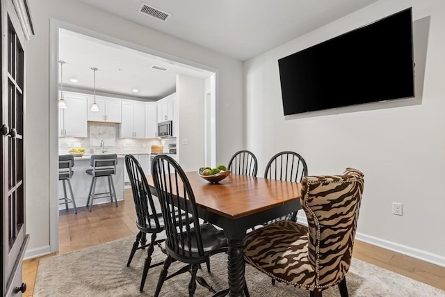 230 Martins Lndg Unit 310, North Reading, MA 01864 - dining area with light wood finished floors and recessed lighting