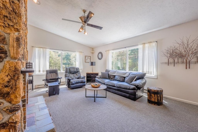 159 School St, Granby, MA 01033 - carpeted living room with a ceiling fan, plenty of natural light, vaulted ceiling, baseboards, and a baseboard radiator