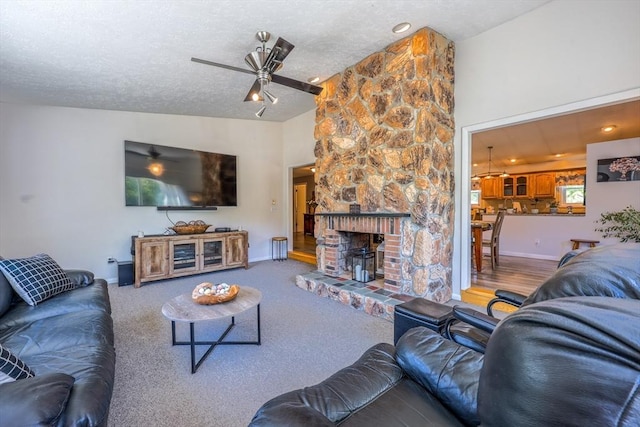159 School St, Granby, MA 01033 - living area featuring a ceiling fan, lofted ceiling, baseboards, a textured ceiling, and carpet