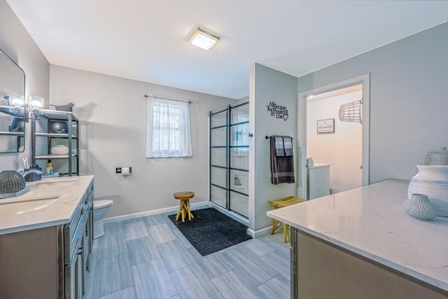 159 School St, Granby, MA 01033 - full bathroom featuring tiled shower, baseboards, vanity, and toilet