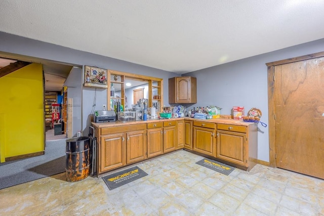 159 School St, Granby, MA 01033 - kitchen with brown cabinetry, light countertops, and baseboards