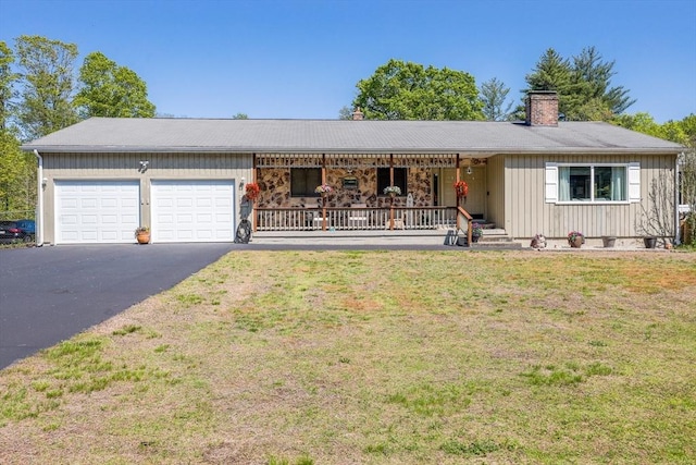159 School St, Granby, MA 01033 - single story home featuring a porch, driveway, a garage, a chimney, and a front lawn