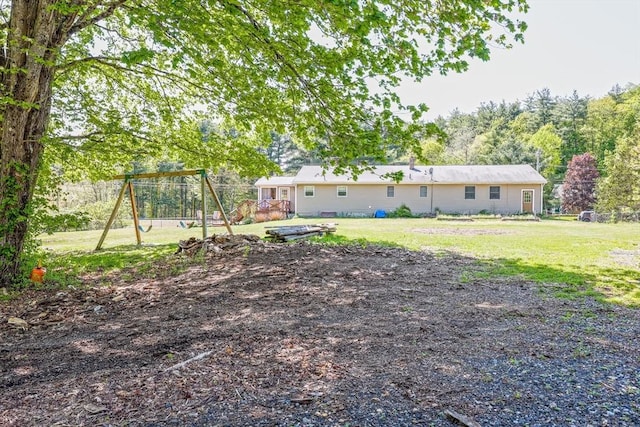 159 School St, Granby, MA 01033 - view of green lawn featuring a playground and a deck