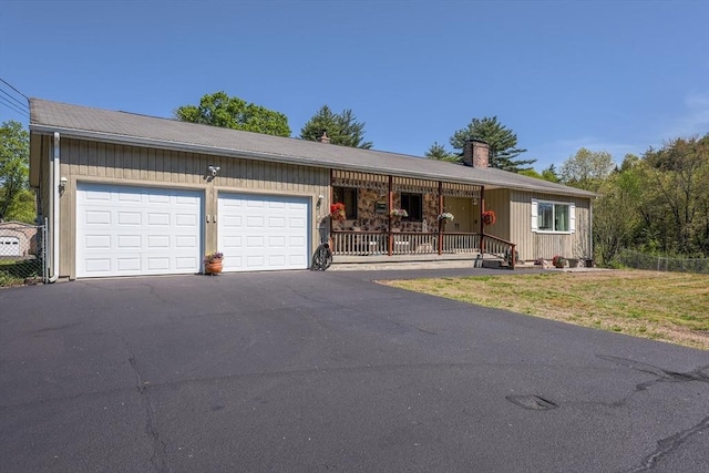 159 School St, Granby, MA 01033 - ranch-style house with an attached garage, driveway, a chimney, and a porch