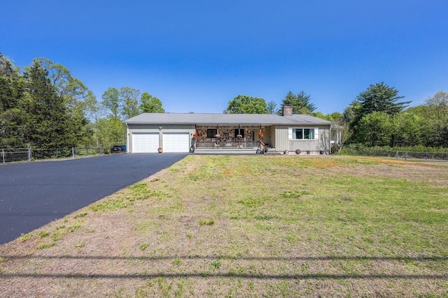 159 School St, Granby, MA 01033 - ranch-style house with covered porch, asphalt driveway, an attached garage, and a chimney