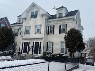 view of front of house with fence