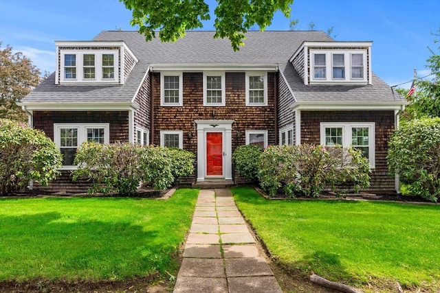 9 Palmer Rd, Marblehead, MA 01945 - shingle-style home with a front lawn and a shingled roof
