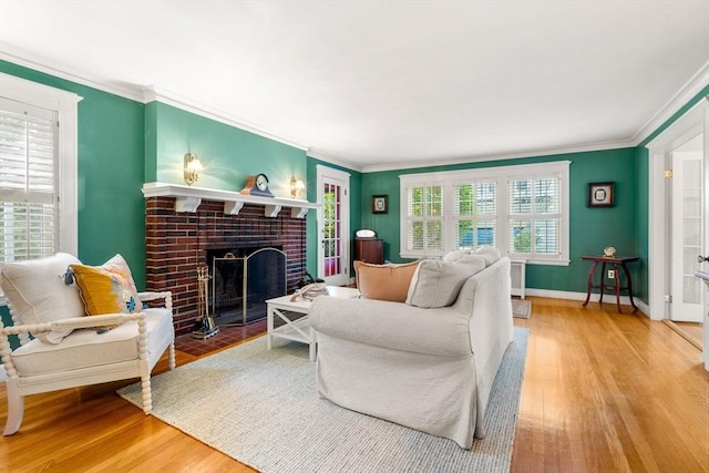 9 Palmer Rd, Marblehead, MA 01945 - living room featuring wood finished floors, a tile fireplace, ornamental molding, and baseboards