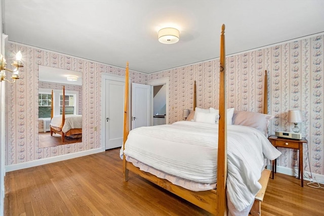 9 Palmer Rd, Marblehead, MA 01945 - bedroom featuring wallpapered walls, wood finished floors, and baseboards