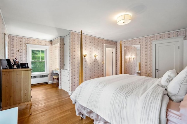 9 Palmer Rd, Marblehead, MA 01945 - bedroom with radiator heating unit, wallpapered walls, and light wood-style floors