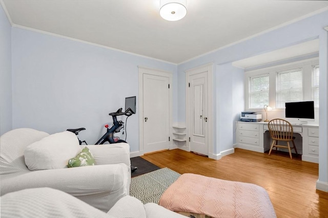 9 Palmer Rd, Marblehead, MA 01945 - living area with light wood finished floors, a desk, crown molding, and baseboards