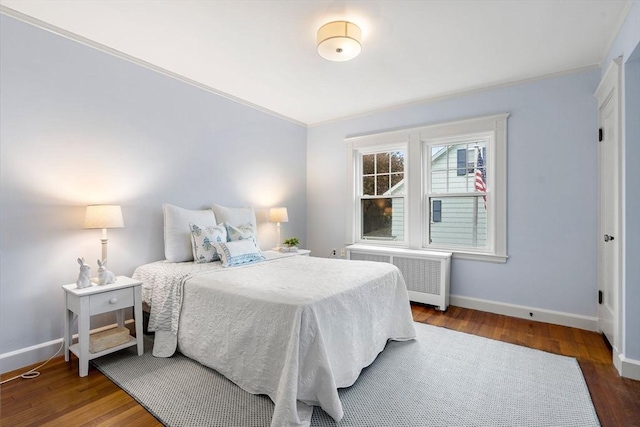 9 Palmer Rd, Marblehead, MA 01945 - bedroom featuring radiator, baseboards, ornamental molding, and wood finished floors