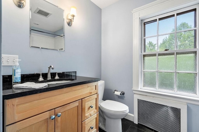 9 Palmer Rd, Marblehead, MA 01945 - bathroom with radiator, toilet, tile patterned flooring, vanity, and baseboards